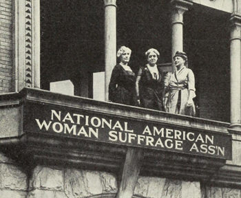 Elizabeth Cady Stanton, Lucy Stone, and Susan B. Anthony stand on balcony of the National American Woman Suffrage Association.