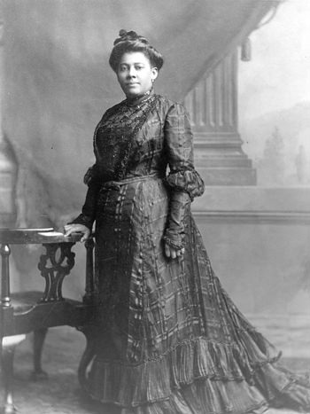 Black and white portrait of Mary B. Talbert standing.